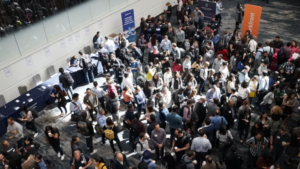 many people gathering at a trade show